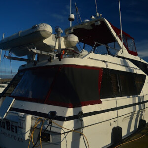 This aft deck enclosure was made with a screen material. This is a great option for warm weather boating days, to keep airflow and add privacy. Aft Deck Enclosure with Screen