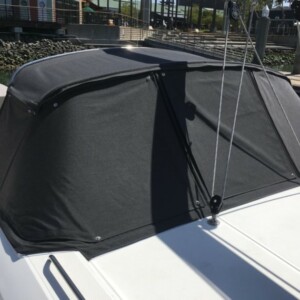 This custom dodger covers the cockpit and companionway from harsh elements. Compass Canvas Beneteau 51 Dodger