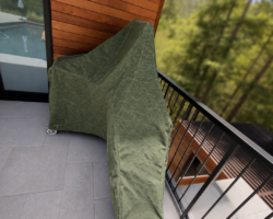 A custom cover for a pool lift so it blends into the forest behind
