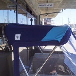 This dodger was custom made for a boat show in April 2020. It is now displayed outside of the Compass Canvas shop in Brickyard Cove. Navy Blue Dodger