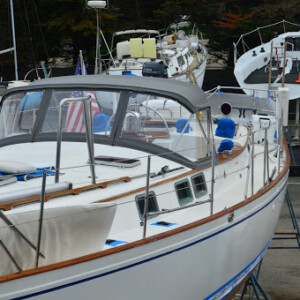 A gray dodger with three window panels, for protection and visibility. Q + M Travels Dodger1