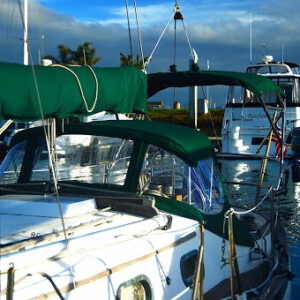 The matching bimini, dodger, and stackpack on this Rafiki 35 makes the boat look great, but also adds protection. Rafiki 35 Bimini and Dodger